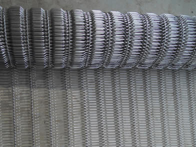 A roll of flat flex conveyor belt with concave surface.