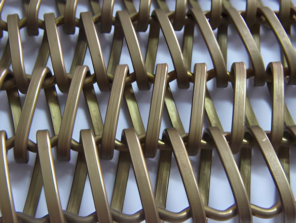 A brass balanced weave conveyor belt on the white background.
