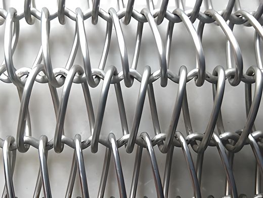 A piece of balanced weave conveyor belt with round wire and crimped cross rod.