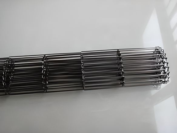 A roll of single loop edge rod network conveyor belt.
