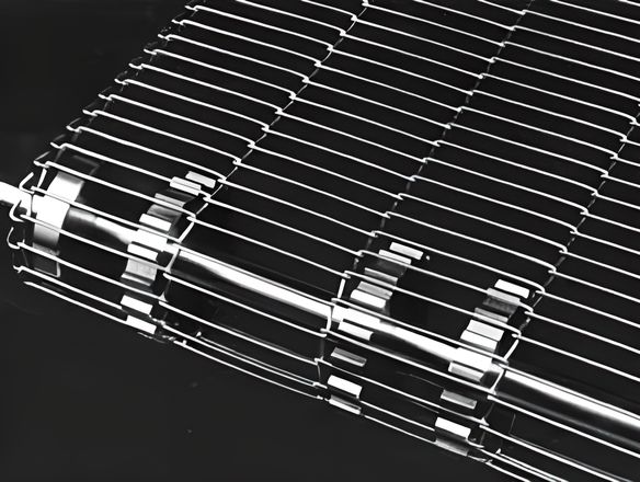 A rod network conveyor belt with sprocket wheel on the machine.