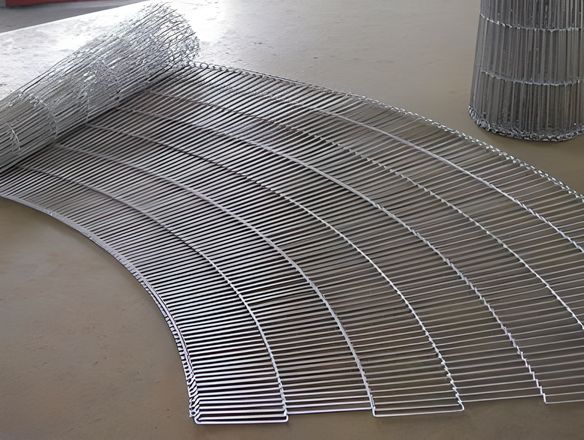 An opened and a closed rod network conveyor belts on the ground.